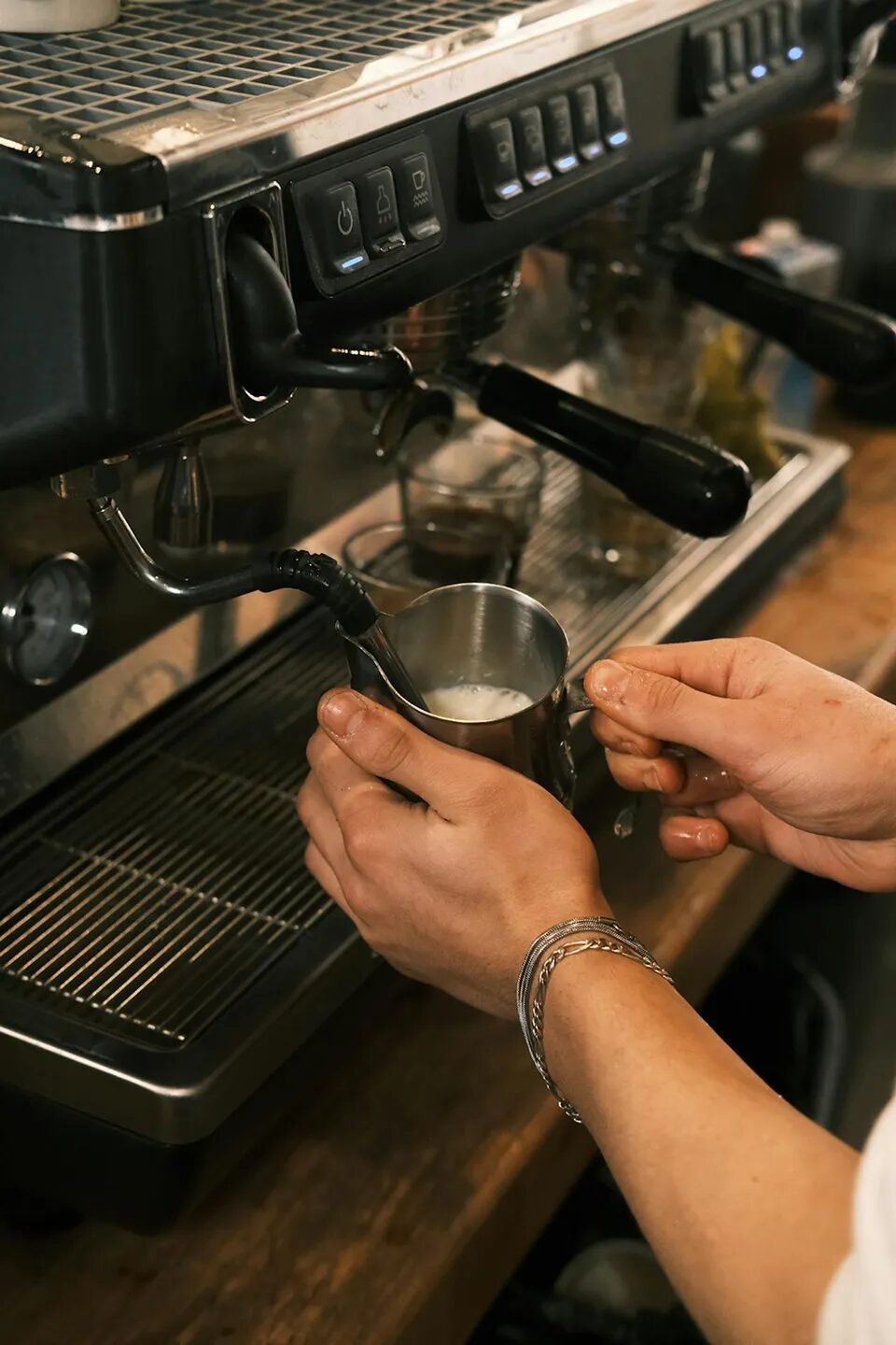 Barista preparing espresso by hand