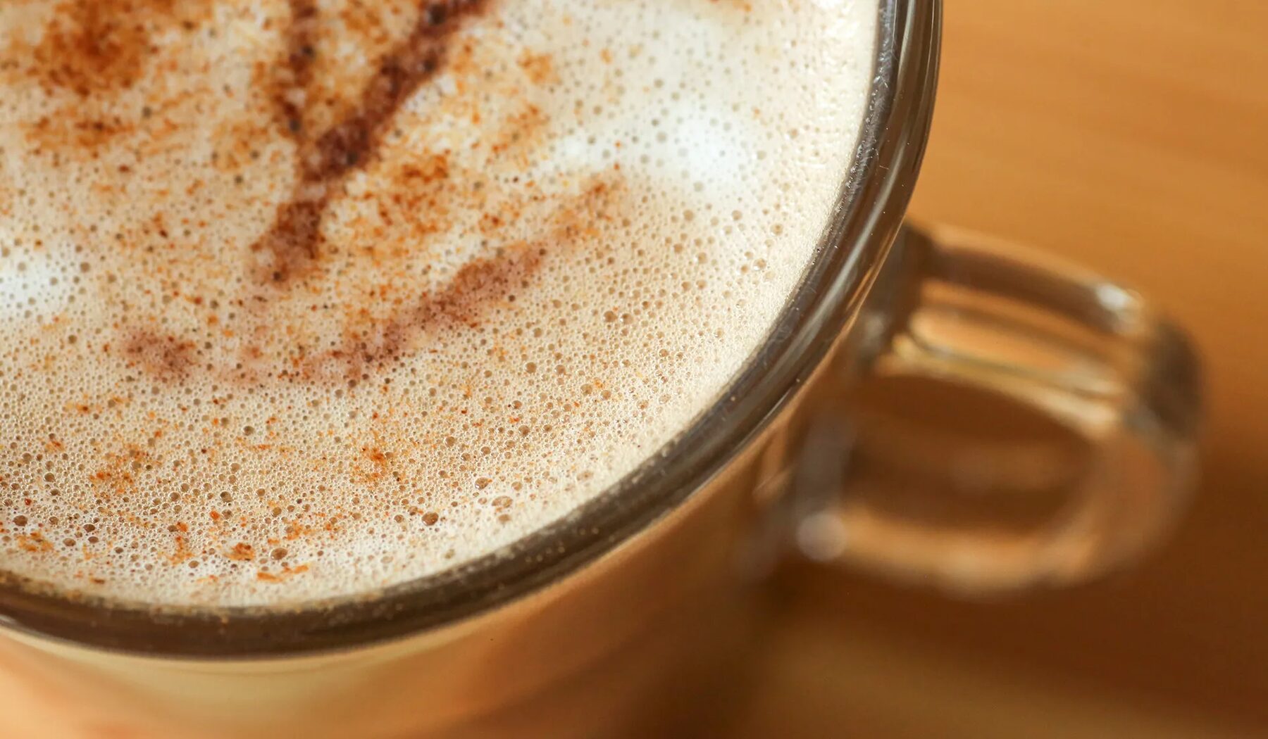 Close-up of latte foam with cinnamon